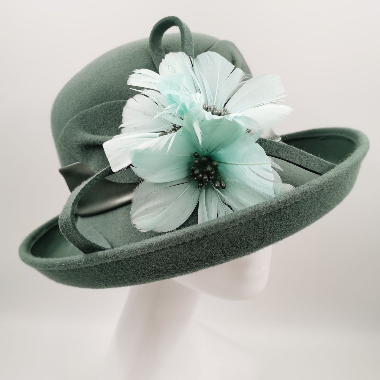 Stunning  olive wool hat with teal embelishment
