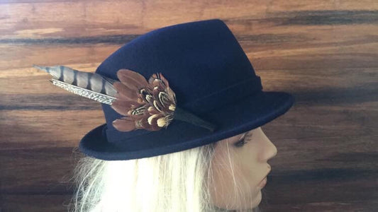 Stunning navy trilby hat with hunter feather trim