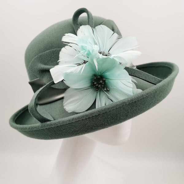 Stunning  olive wool hat with teal embelishment
