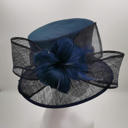 Elegant Navy Sinamay hat with rises and cut feathers trim