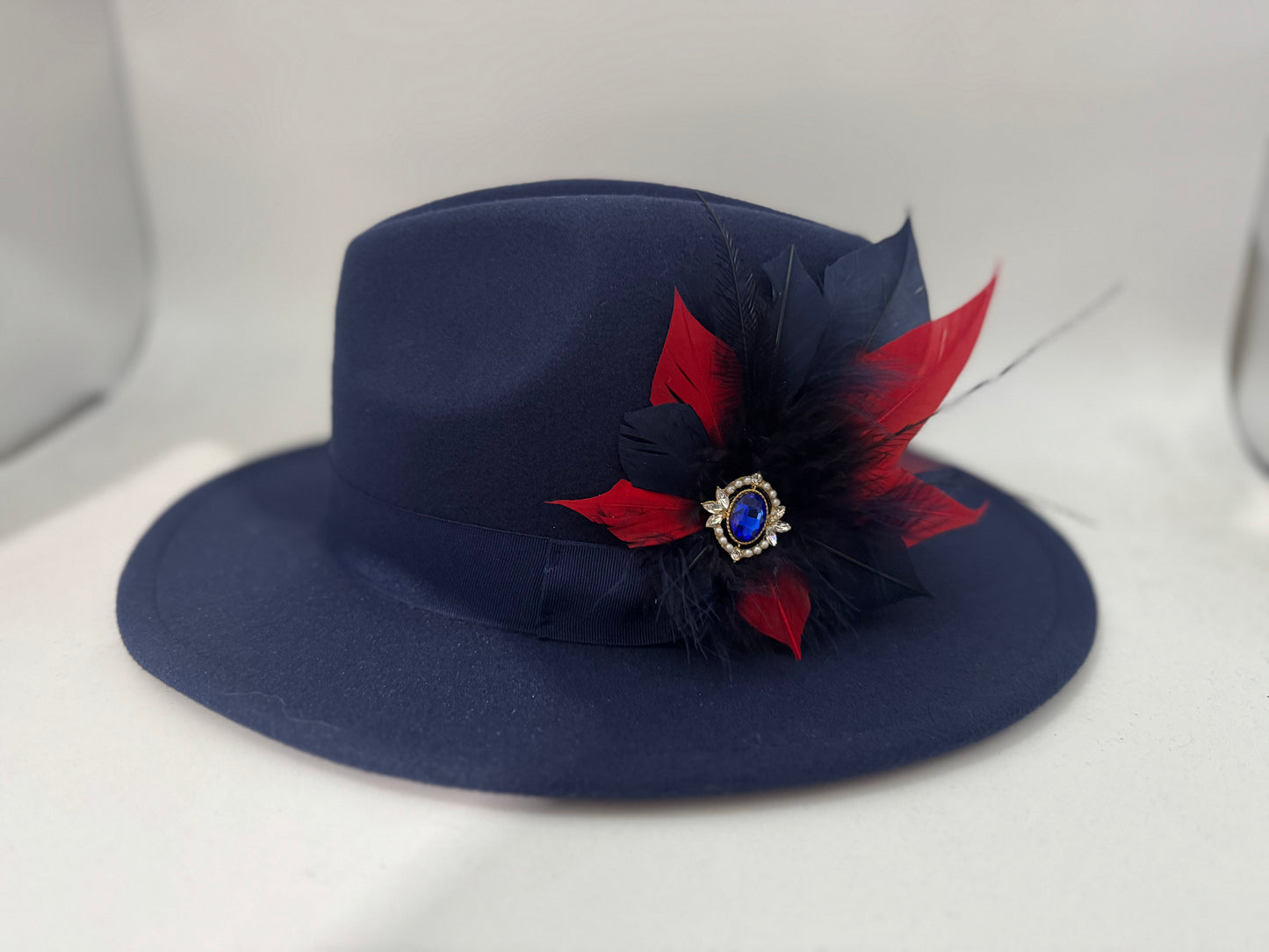 Navy Panama hat with Feather Trim on a removable magnetic