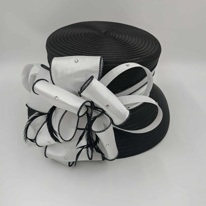 Small brim black hat with white embellishments