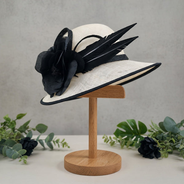 White sinamay piece with black trim arriving end of March 2026