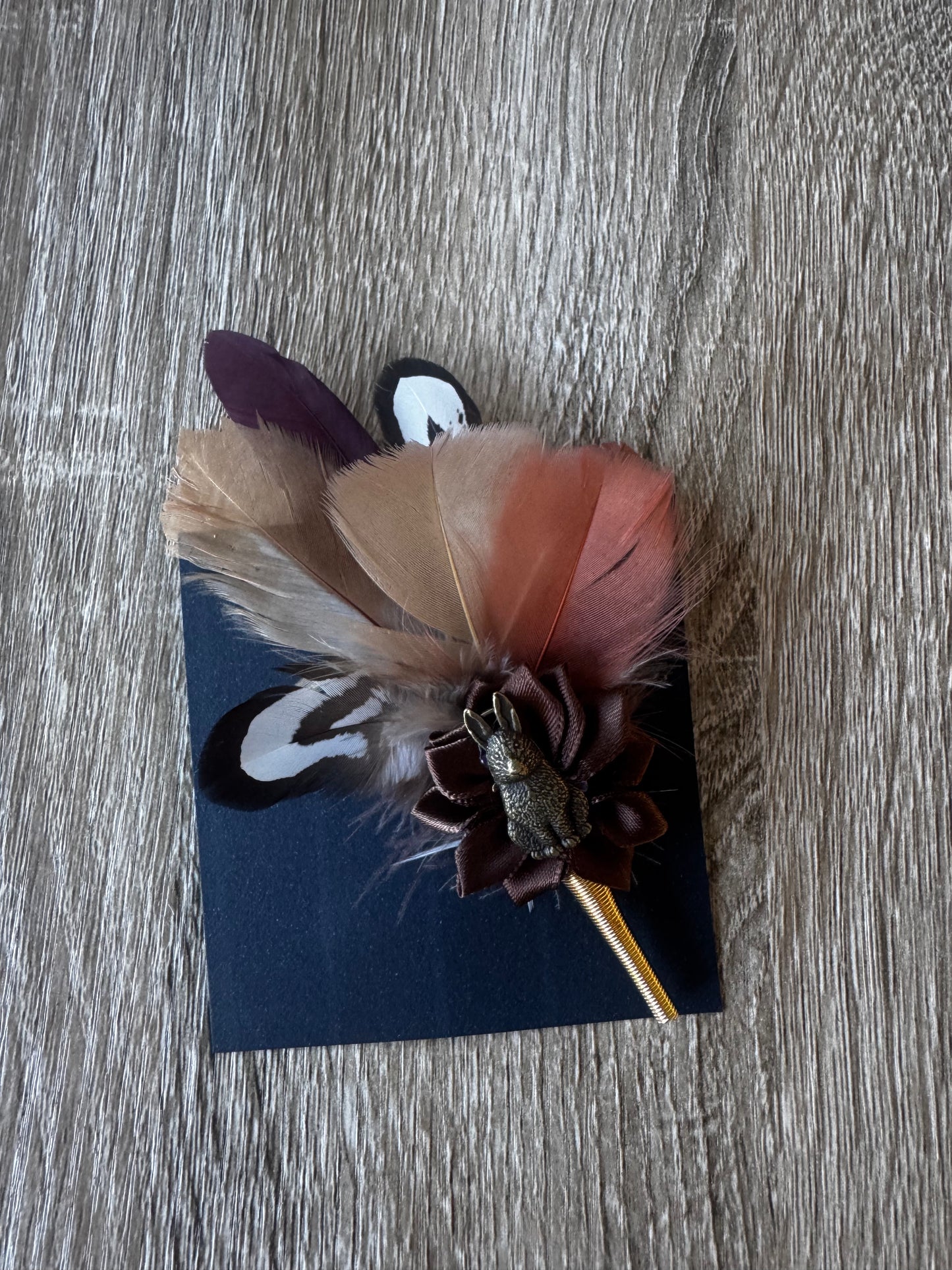 Hunter feather 🪶 on a pin
