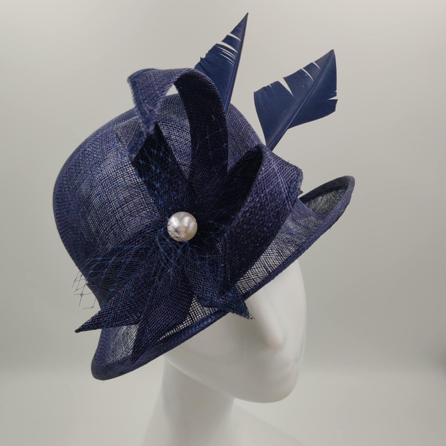 Navy blue sinamay hat with feather